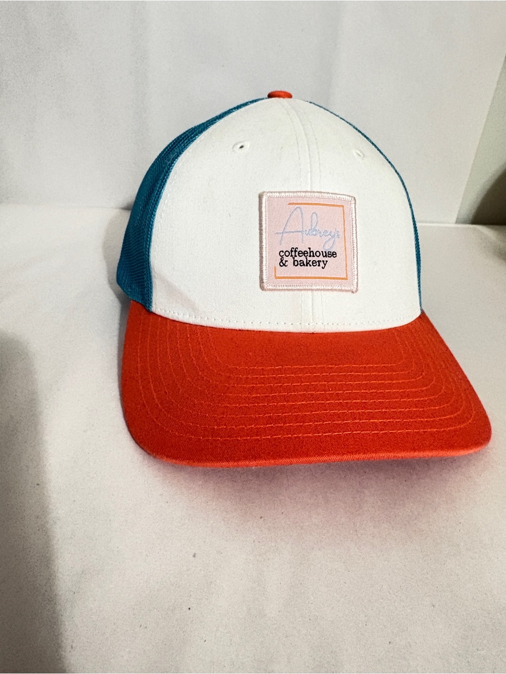 Aubrey’s Coffeehouse & Bakery Colorblock Trucker Hat